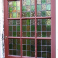 Damaged stained glass door panels restored
